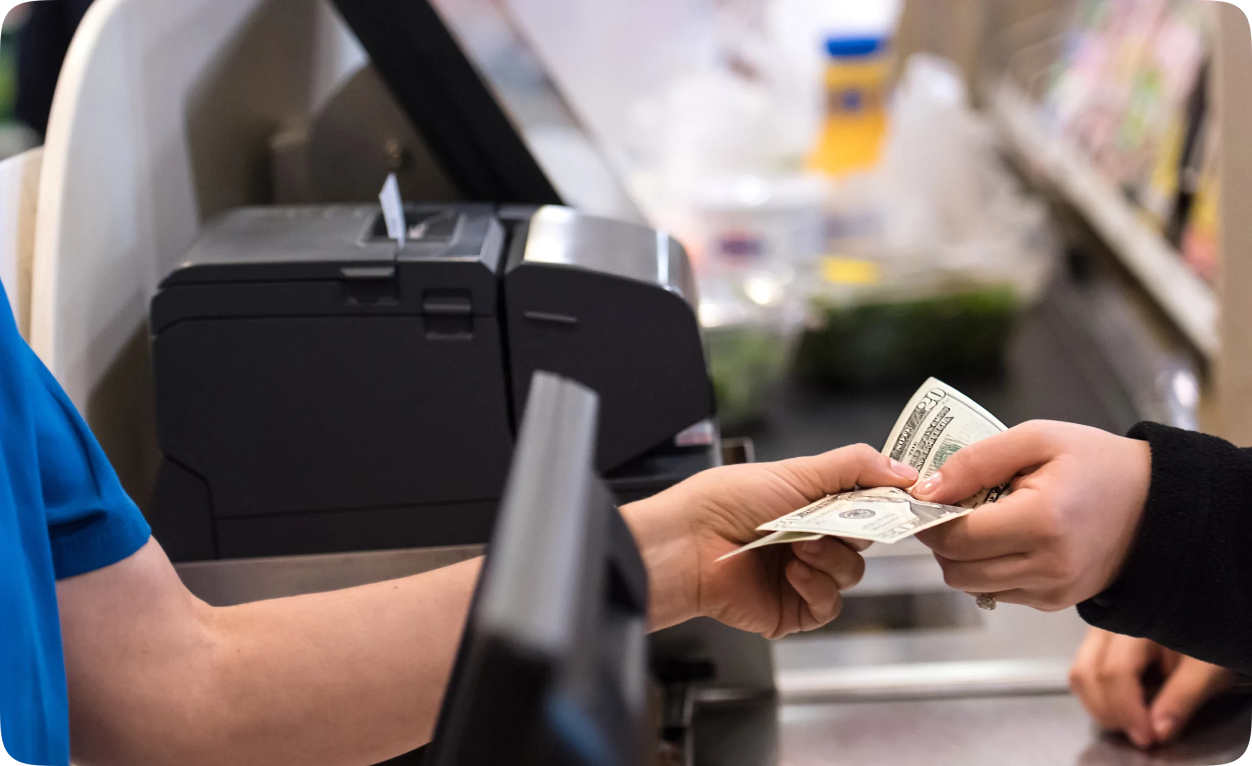 Desktop and smartphone displaying PointsKash interface on a workspace desk